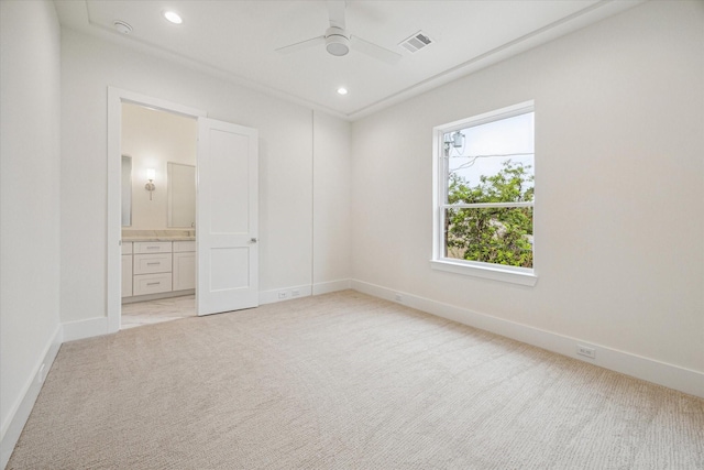 519 W 27th St, Houston, TX 77008 - unfurnished bedroom featuring ensuite bath, visible vents, baseboards, and light carpet
