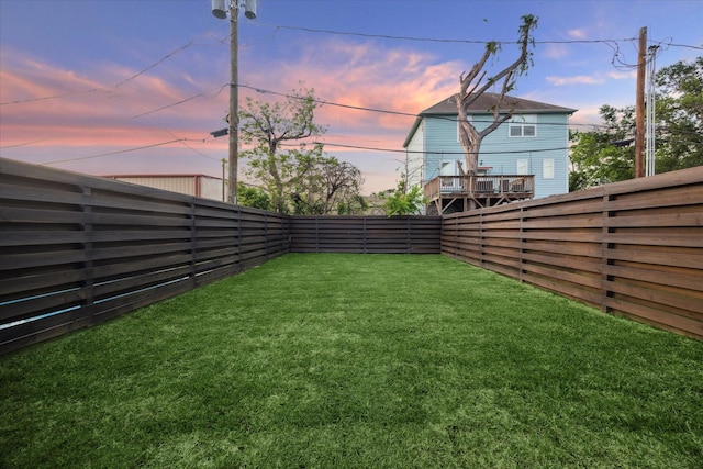 519 W 27th St, Houston, TX 77008 - yard at dusk with a fenced backyard