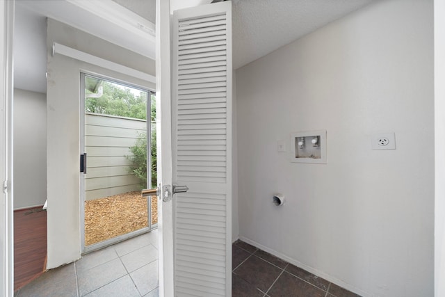 washroom featuring laundry area, tile patterned floors, electric dryer hookup, baseboards, and hookup for a washing machine