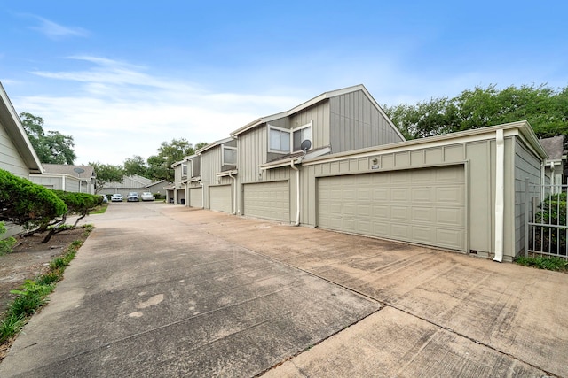 view of side of property featuring a garage and board and batten siding