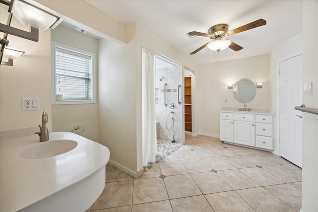 1415 Stependale Dr, Katy, TX 77450 - bathroom featuring a stall shower, a ceiling fan, baseboards, tile patterned flooring, and vanity