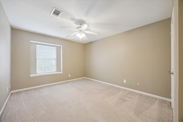 1415 Stependale Dr, Katy, TX 77450 - unfurnished room with a ceiling fan, a textured ceiling, visible vents, baseboards, and light colored carpet