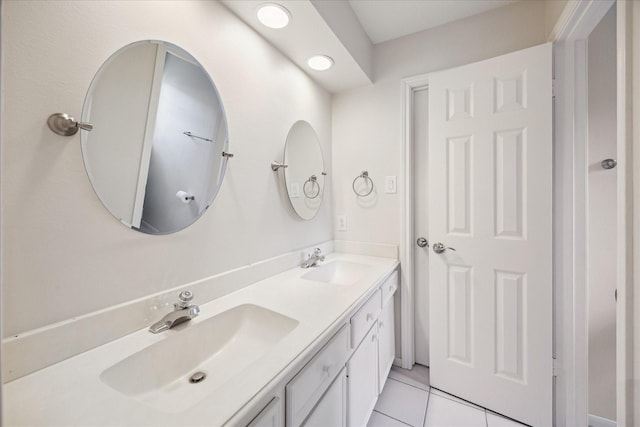 1415 Stependale Dr, Katy, TX 77450 - bathroom with tile patterned floors, double vanity, and a sink