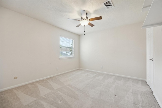 1415 Stependale Dr, Katy, TX 77450 - unfurnished room with light carpet, baseboards, a ceiling fan, and visible vents