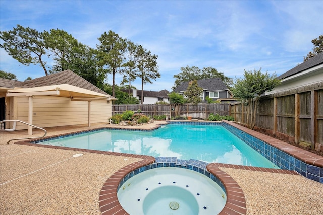 1415 Stependale Dr, Katy, TX 77450 - view of pool featuring a pool with connected hot tub and a fenced backyard
