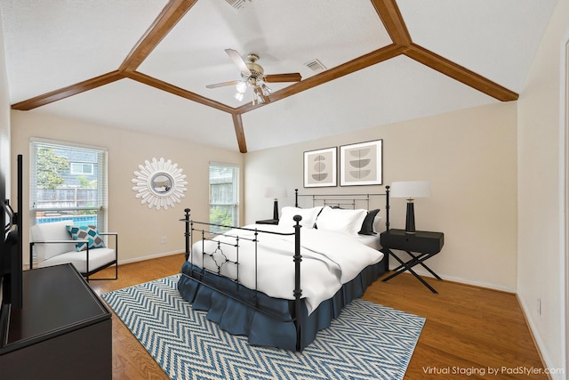 1415 Stependale Dr, Katy, TX 77450 - bedroom featuring baseboards, multiple windows, wood finished floors, and vaulted ceiling
