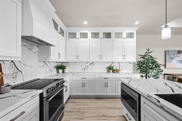 kitchen with appliances with stainless steel finishes, custom exhaust hood, white cabinetry, decorative light fixtures, and recessed lighting