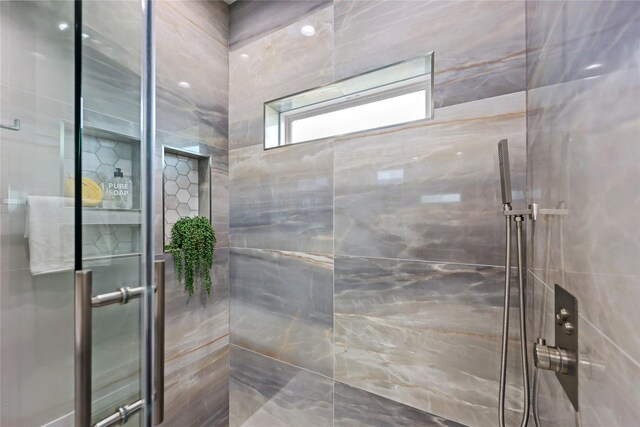 full bath with a shower stall