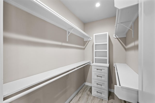 walk in closet featuring light wood-style floors