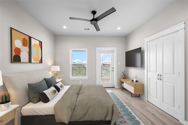 bedroom with access to exterior, light wood finished floors, recessed lighting, and a ceiling fan