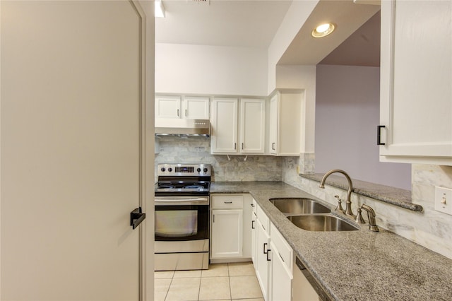 kitchen featuring a sink, tasteful backsplash, under cabinet range hood, light tile patterned floors, and electric range