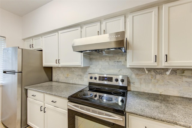 kitchen with stainless steel appliances, ventilation hood, white cabinets, light stone countertops, and decorative backsplash