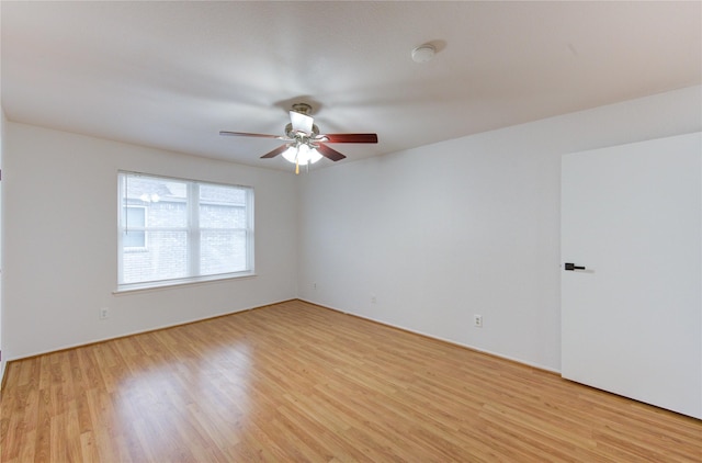 empty room featuring ceiling fan and light wood-style flooring