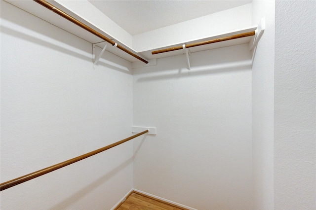 walk in closet featuring light wood-style flooring
