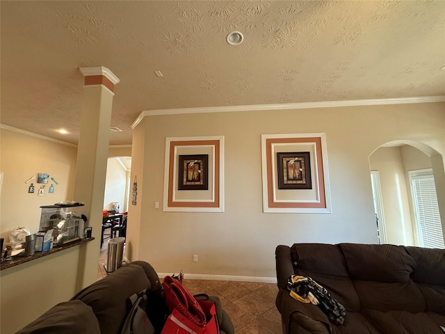 living area with arched walkways, baseboards, tile patterned floors, and crown molding