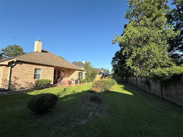 view of yard featuring a fenced backyard