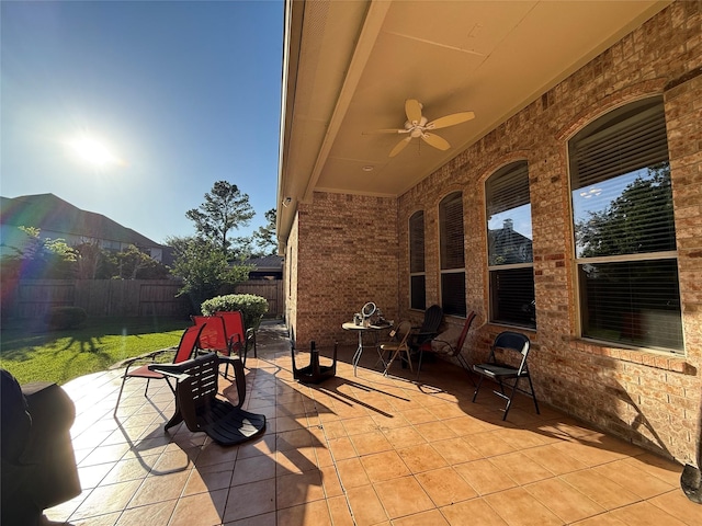 view of patio / terrace with a fenced backyard and ceiling fan