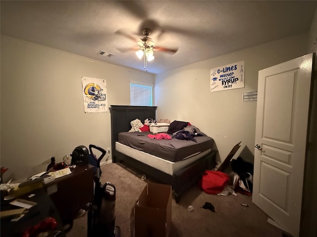 bedroom featuring ceiling fan, carpet flooring, and visible vents