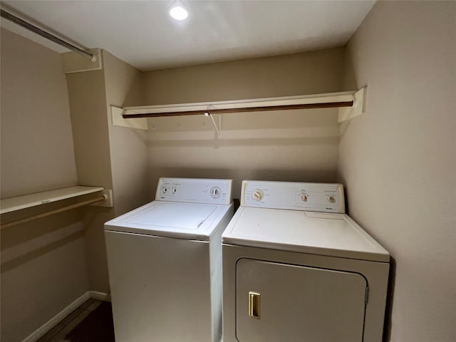 laundry room featuring baseboards, laundry area, and washing machine and dryer