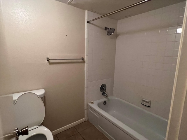 full bath featuring toilet, tile patterned flooring, baseboards, and  shower combination