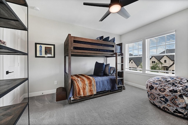 bedroom with carpet floors, baseboards, and a ceiling fan