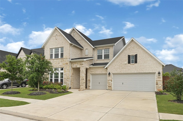 view of front facade featuring concrete driveway, brick siding, a front yard, and a garage