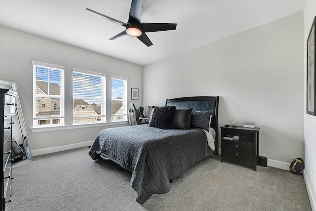 bedroom with baseboards, a ceiling fan, and carpet floors