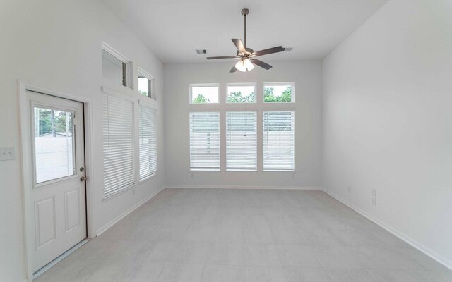 23403 Malbec Dr, Alvin, TX 77511 - spare room featuring a ceiling fan and baseboards