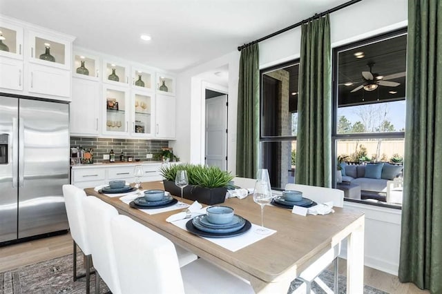 dining area with light wood-style flooring
