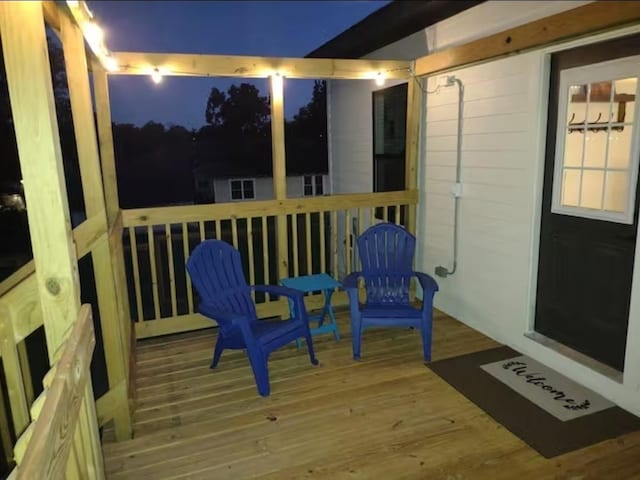 704 Burleson St, Brenham, TX 77833 - view of deck at twilight