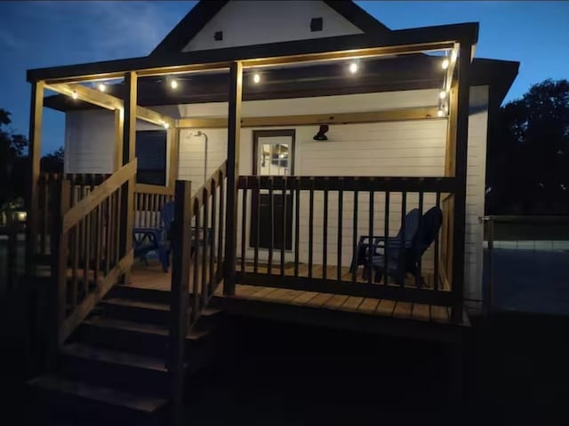 view of back of house at twilight