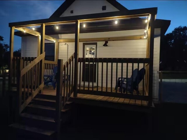 704 Burleson St, Brenham, TX 77833 - view of deck at twilight