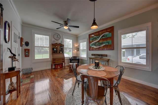 704 Burleson St, Brenham, TX 77833 - dining area featuring hardwood / wood-style floors, crown molding, and a ceiling fan