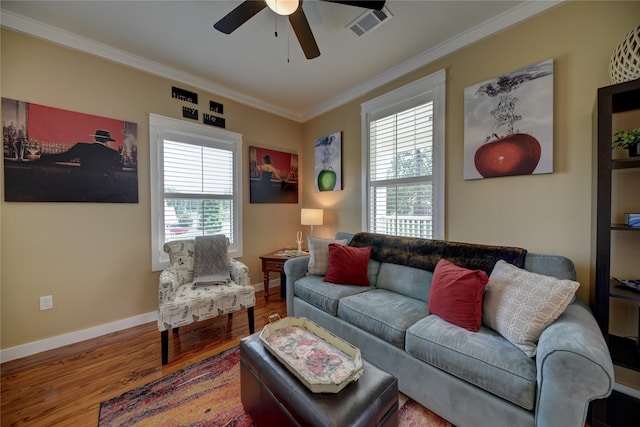 704 Burleson St, Brenham, TX 77833 - living area with crown molding, ceiling fan, and wood finished floors