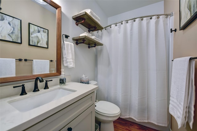 704 Burleson St, Brenham, TX 77833 - bathroom featuring vanity, wood finished floors, and curtained shower