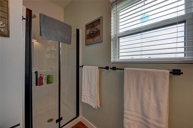 704 Burleson St, Brenham, TX 77833 - full bathroom featuring a shower stall and baseboards