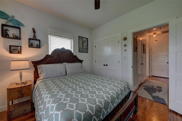 704 Burleson St, Brenham, TX 77833 - bedroom with wood finished floors, a closet, and ceiling fan