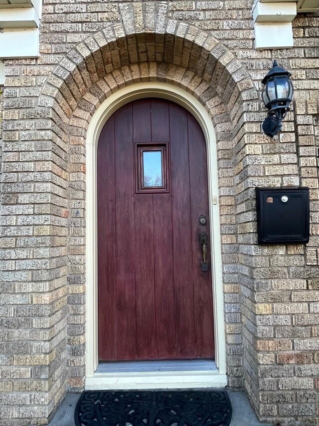 4701 Avenue N 1/2 Ave N 1/2, Galveston, TX 77551 - view of exterior entry with brick siding