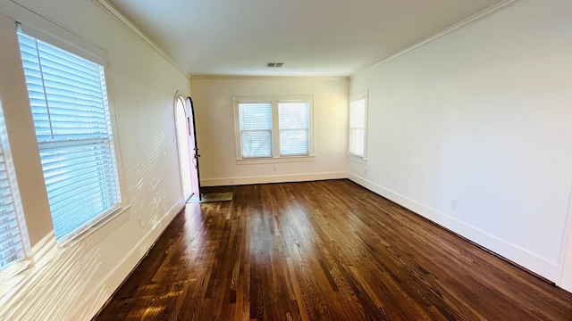 4701 Avenue N 1/2 Ave N 1/2, Galveston, TX 77551 - empty room featuring ornamental molding, baseboards, visible vents, and wood finished floors