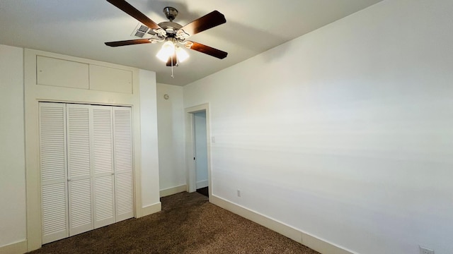 4701 Avenue N 1/2 Ave N 1/2, Galveston, TX 77551 - unfurnished bedroom with a closet, baseboards, a ceiling fan, and dark carpet