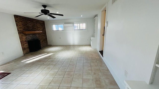 4701 Avenue N 1/2 Ave N 1/2, Galveston, TX 77551 - unfurnished living room featuring a ceiling fan, an AC wall unit, light tile patterned floors, visible vents, and a brick fireplace
