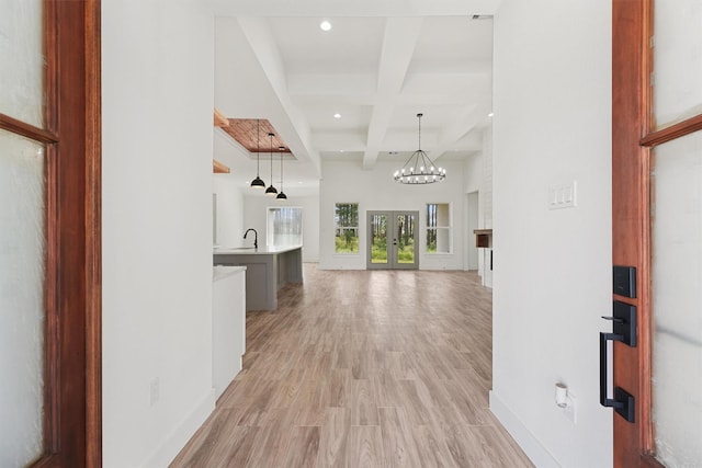 679 Rd 66111, Dayton, TX 77535 - corridor featuring recessed lighting, coffered ceiling, baseboards, a sink, and beam ceiling