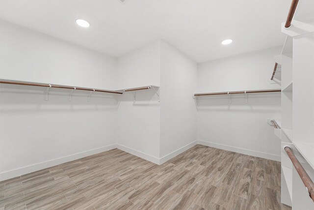 679 Rd 66111, Dayton, TX 77535 - spacious closet with wood finished floors