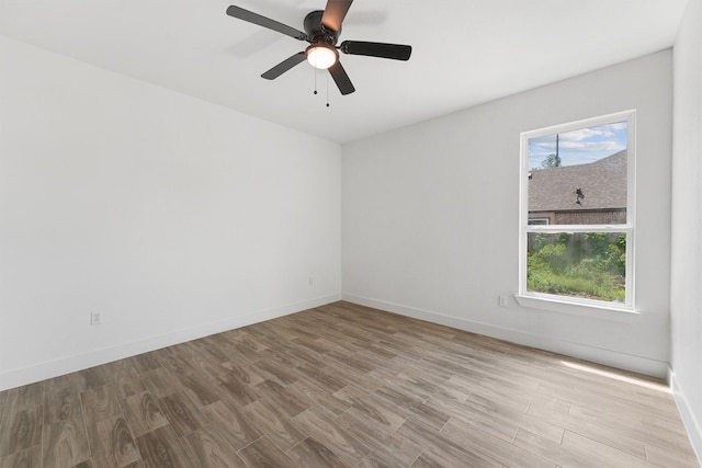 679 Rd 66111, Dayton, TX 77535 - empty room featuring baseboards, ceiling fan, and wood finished floors