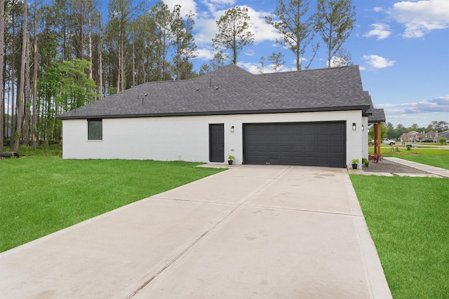 679 Rd 66111, Dayton, TX 77535 - view of home's exterior featuring an attached garage, concrete driveway, a shingled roof, and a lawn