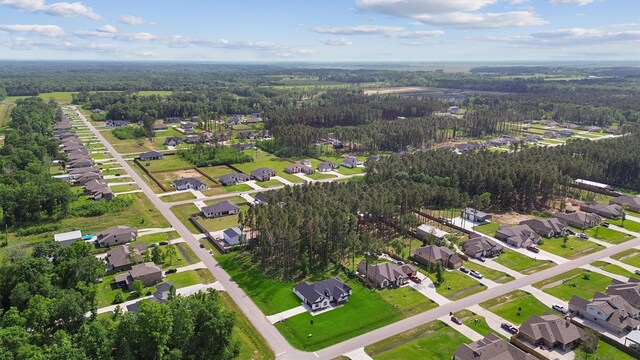 679 Rd 66111, Dayton, TX 77535 - bird's eye view featuring a wooded view and a residential view
