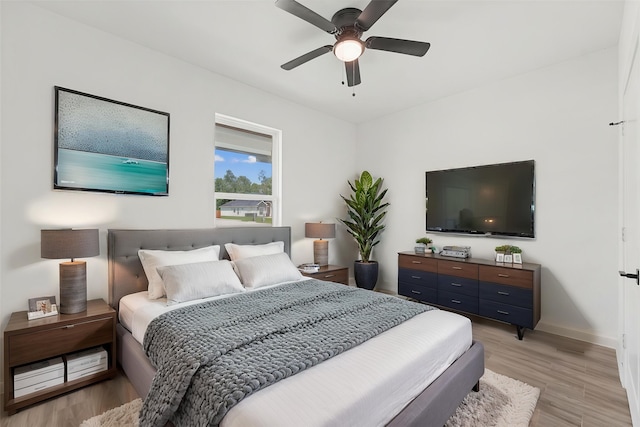 679 Rd 66111, Dayton, TX 77535 - bedroom featuring baseboards, light wood-style flooring, and ceiling fan