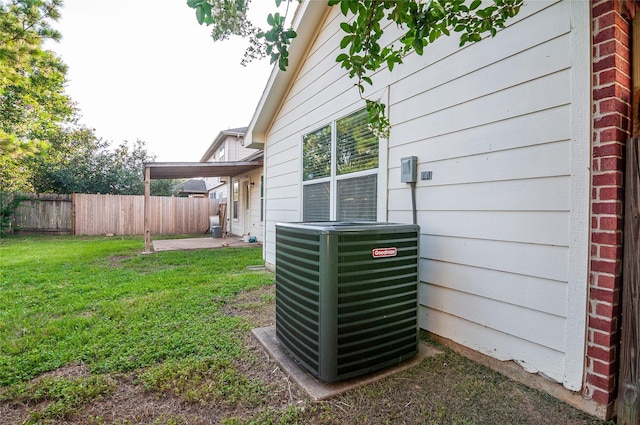 details featuring central AC unit and fence