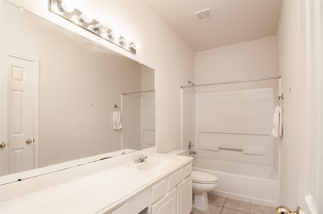 bathroom featuring toilet, vanity, visible vents, tile patterned floors, and washtub / shower combination
