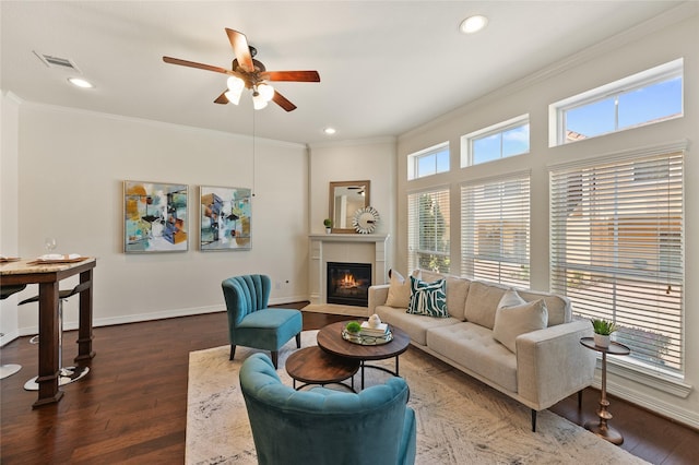 26 W Oaks Dr, Houston, TX 77058 - living area featuring a glass covered fireplace, crown molding, ceiling fan, wood finished floors, and baseboards